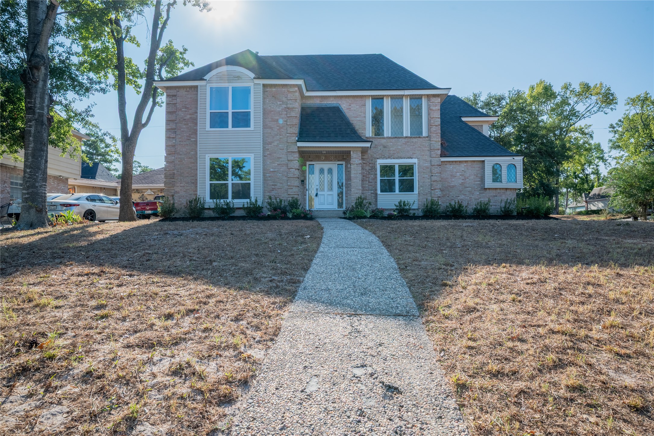 a front view of a house with a yard