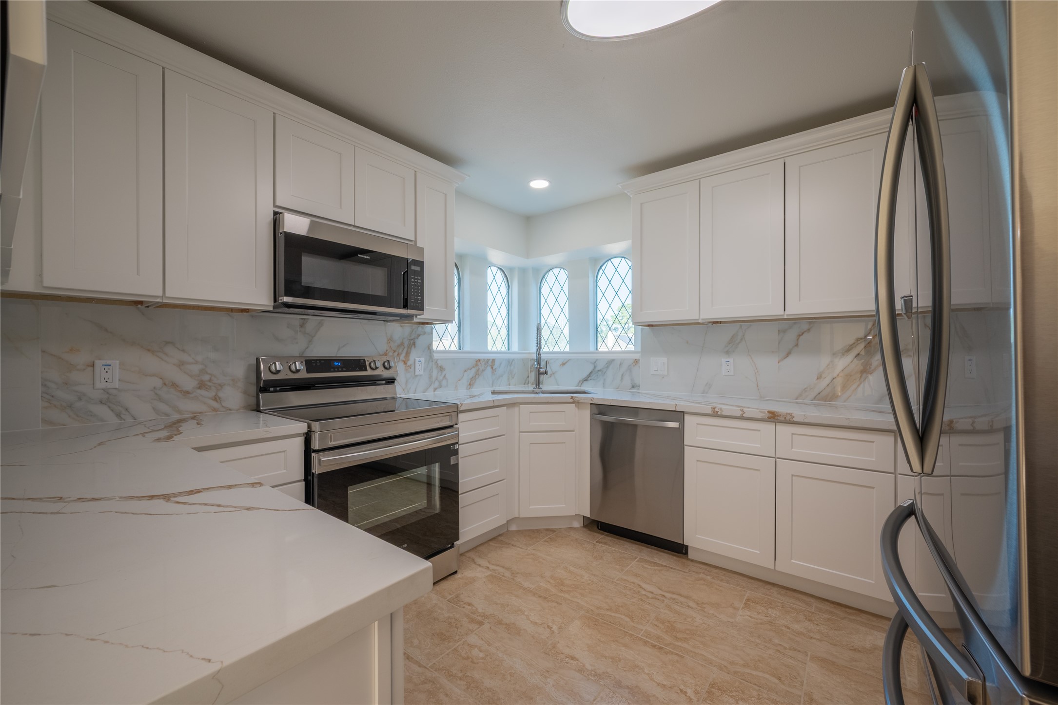 1923 Big Horn Drive Houston, TX 77090 - Photo 13 of 48 a kitchen with stainless steel appliances granite countertop a refrigerator sink and stove