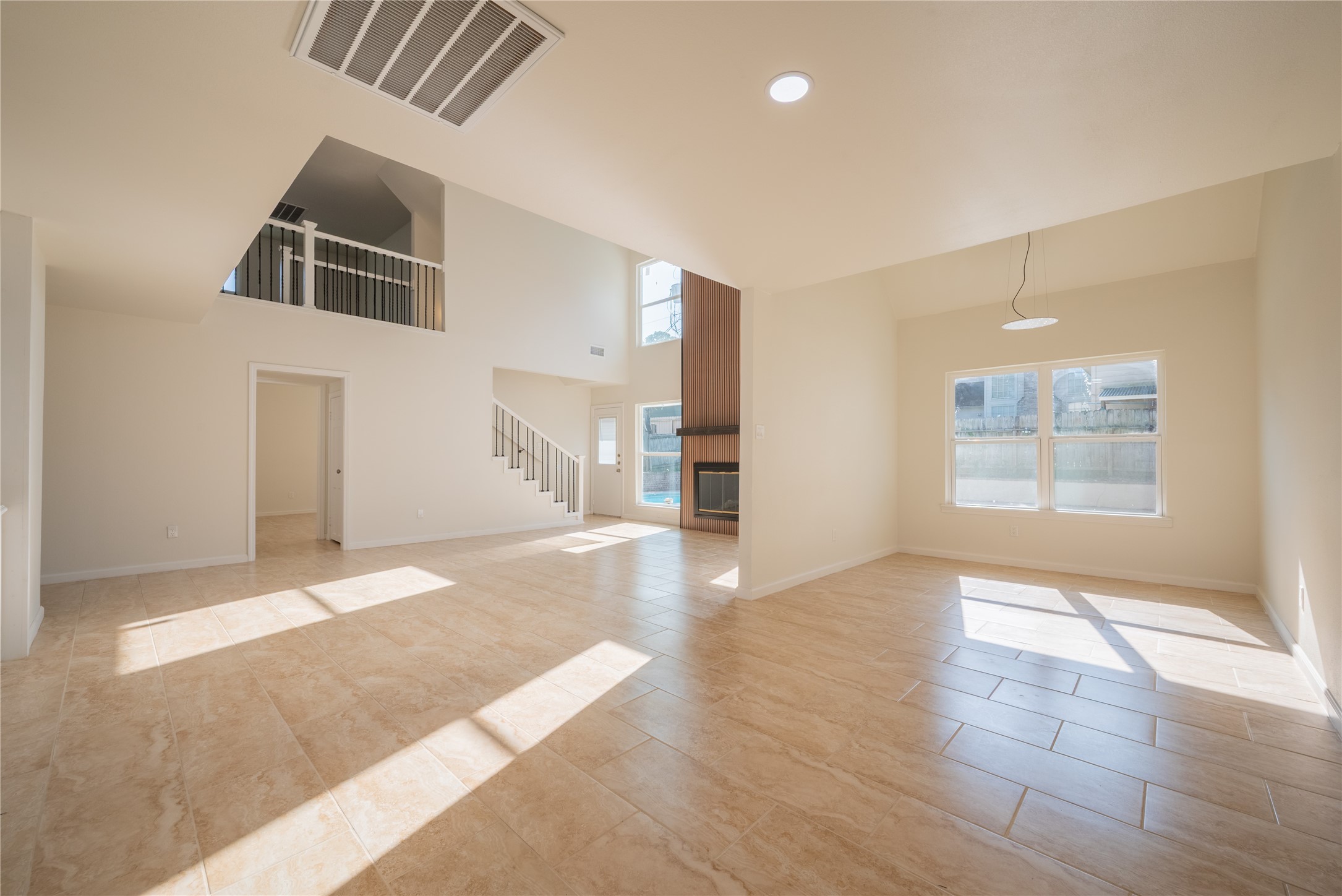 1923 Big Horn Drive Houston, TX 77090 - Photo 15 of 48 an empty room with wooden floor and windows