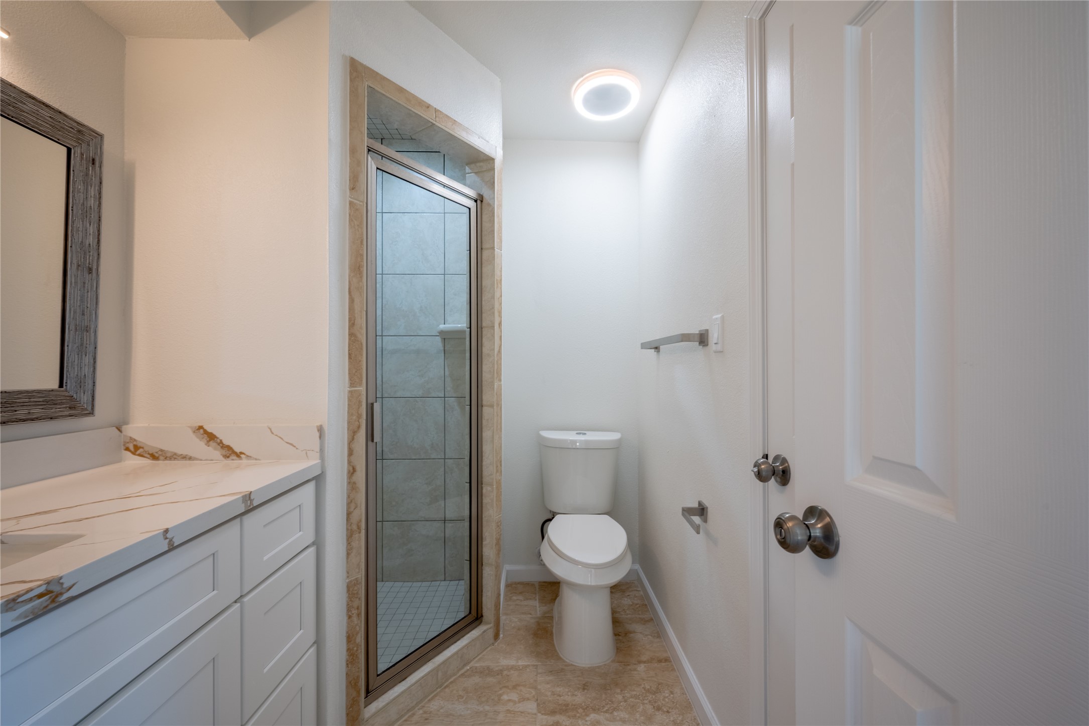 1923 Big Horn Drive Houston, TX 77090 - Photo 37 of 48 a bathroom with a granite countertop sink toilet and shower