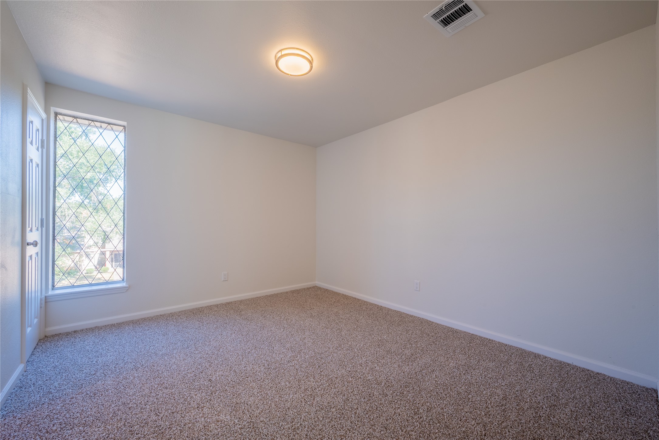 1923 Big Horn Drive Houston, TX 77090 - Photo 38 of 48 an empty room with windows