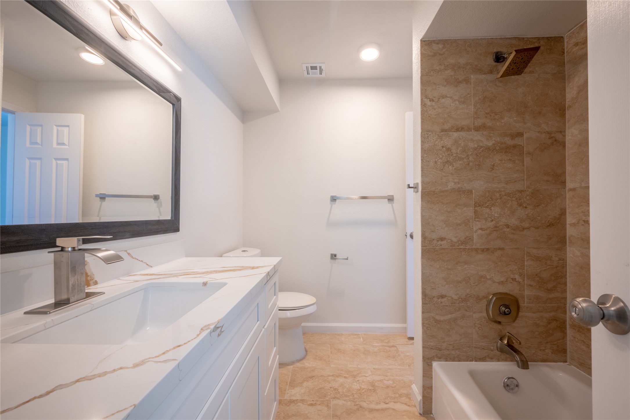 1923 Big Horn Drive Houston, TX 77090 - Photo 41 of 48 a bathroom with a sink a toilet and shower