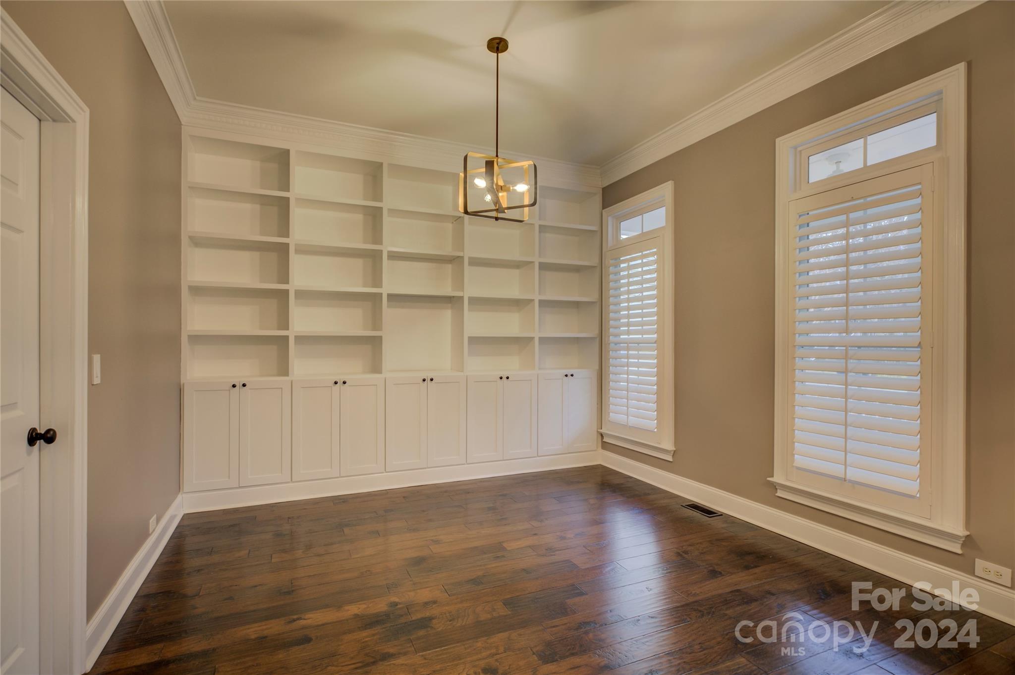 747 Julia Street Fort Mill, SC 29708 - Photo 9 of 47 a view of a room with wooden floor and windows
