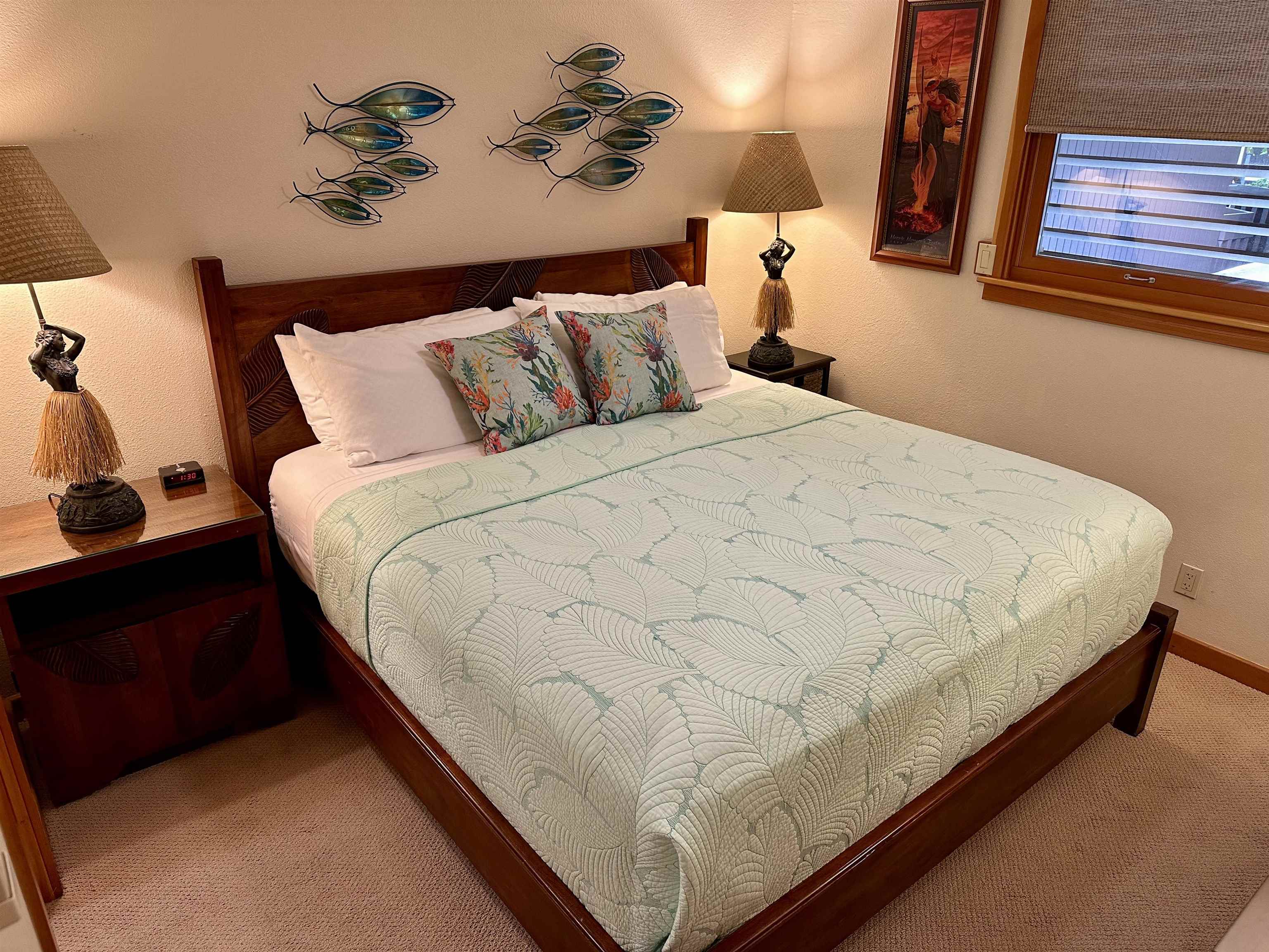 2994 South Kihei Road, Unit 203 Kihei, HI 96753 - Photo 12 of 28 a large bed sitting in a bedroom next to a window