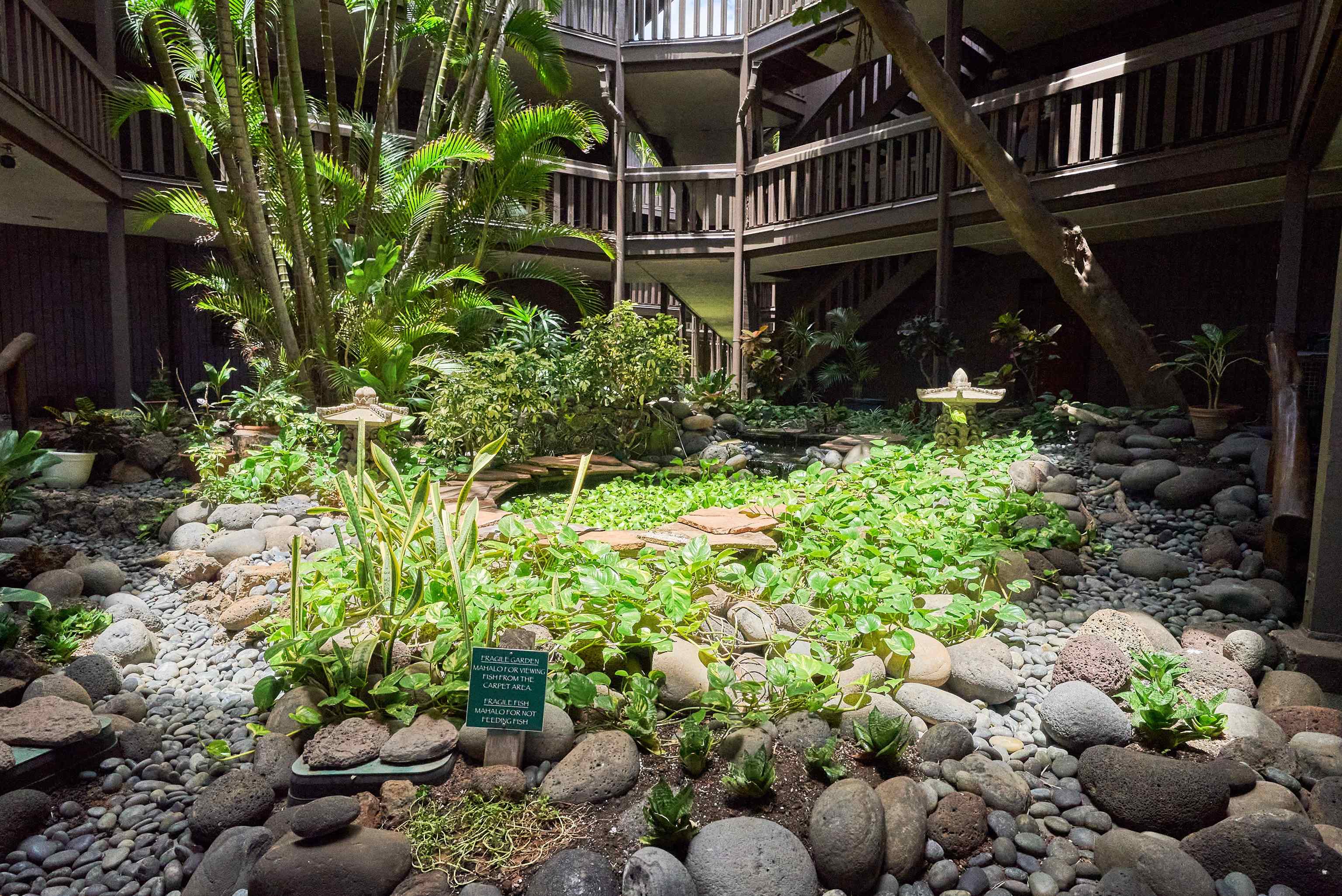 2994 South Kihei Road, Unit 203 Kihei, HI 96753 - Photo 24 of 28 a view of a house with a flower garden