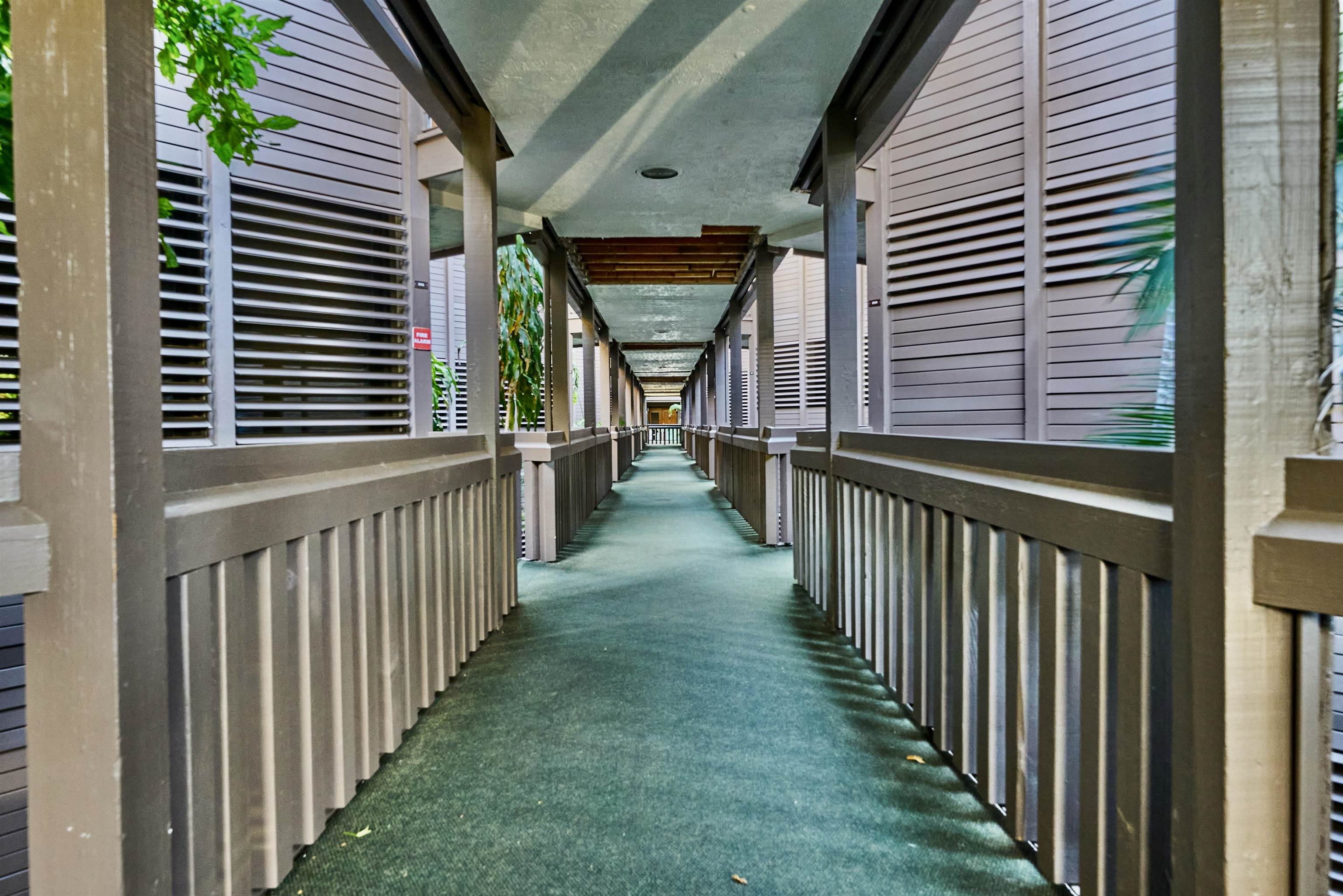 2994 South Kihei Road, Unit 203 Kihei, HI 96753 - Photo 25 of 28 a view of a porch with wooden floor and stairs