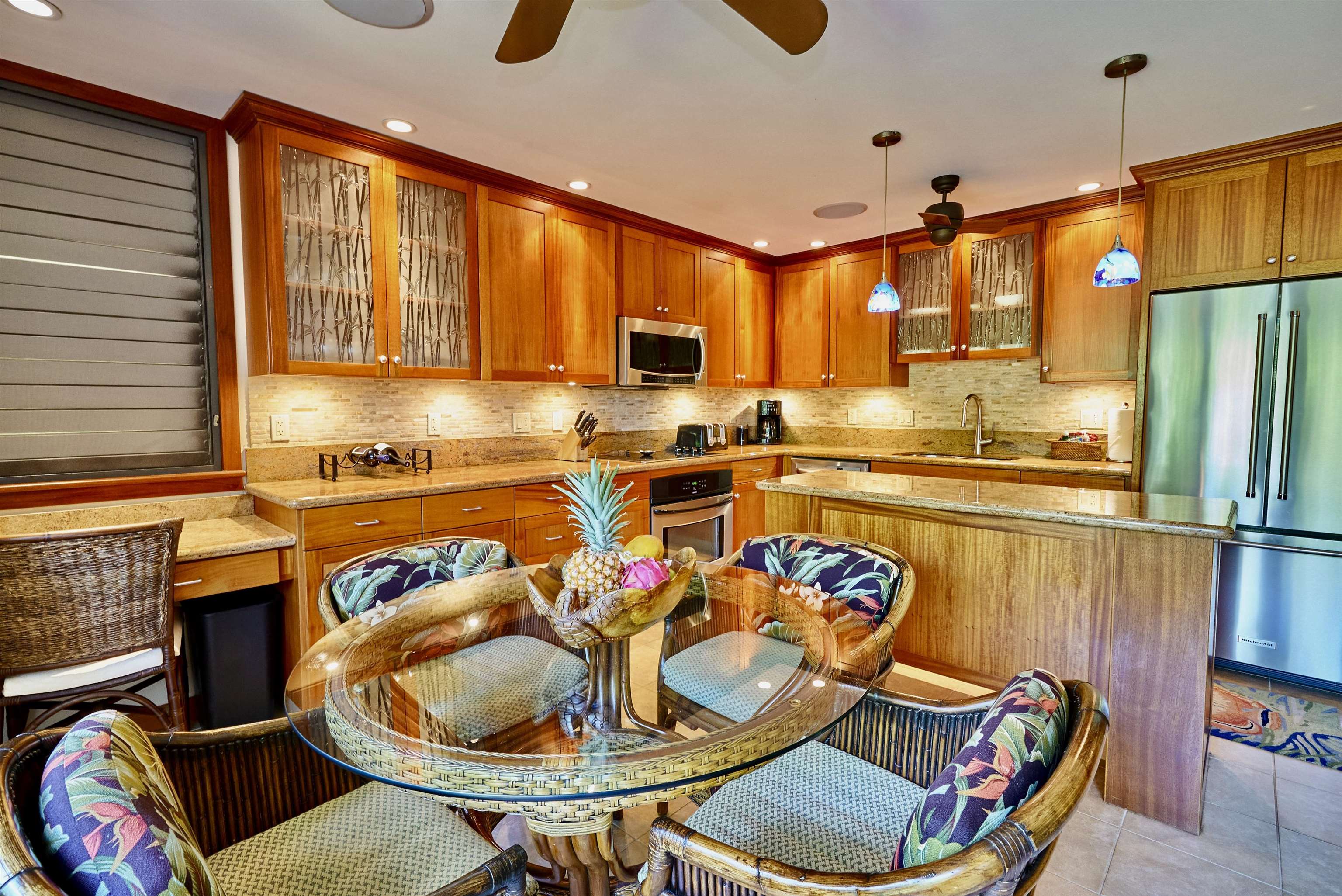2994 South Kihei Road, Unit 203 Kihei, HI 96753 - Photo 4 of 28 a kitchen with stainless steel appliances granite countertop a sink and a refrigerator