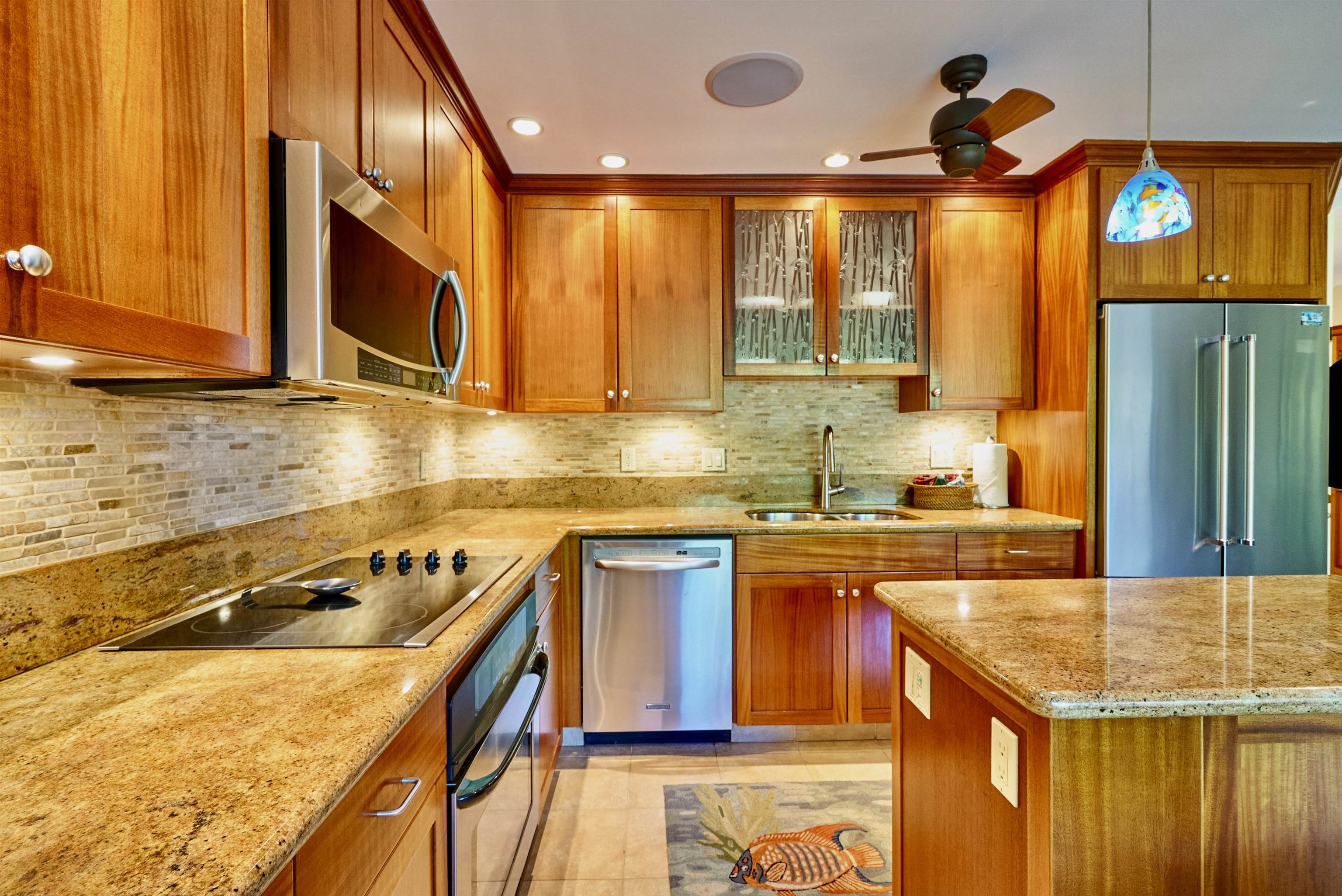 2994 South Kihei Road, Unit 203 Kihei, HI 96753 - Photo 5 of 28 a kitchen that has a sink and a stove in it
