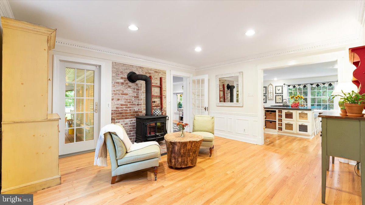 11900 Bennett Road Oak Hill, VA 20171 - Photo 22 of 104 Original hardwood, brick, & wood-burning stove.