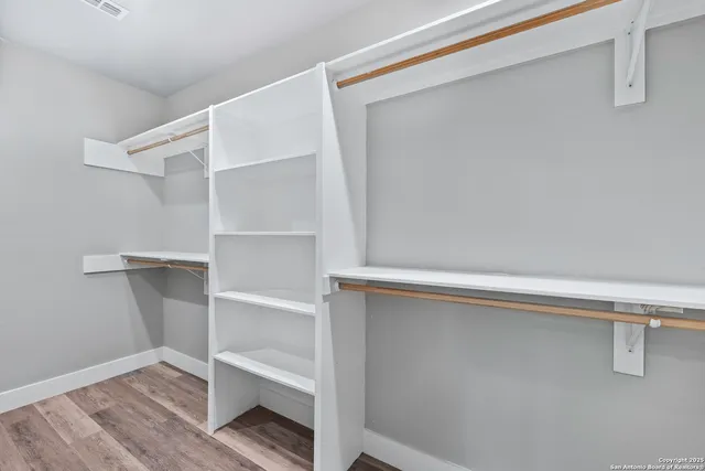 a view of an empty walk in closet