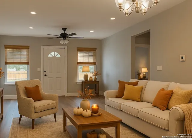 a living room with furniture and a chandelier