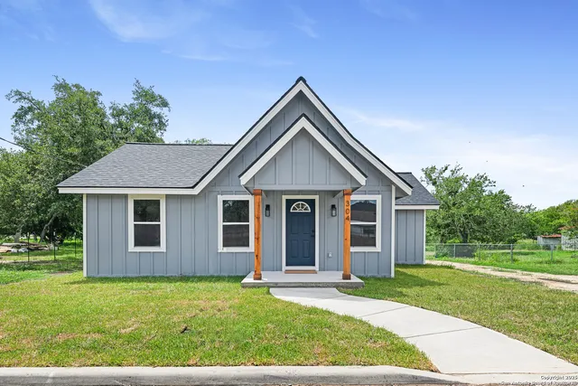 front view of a house with a yard
