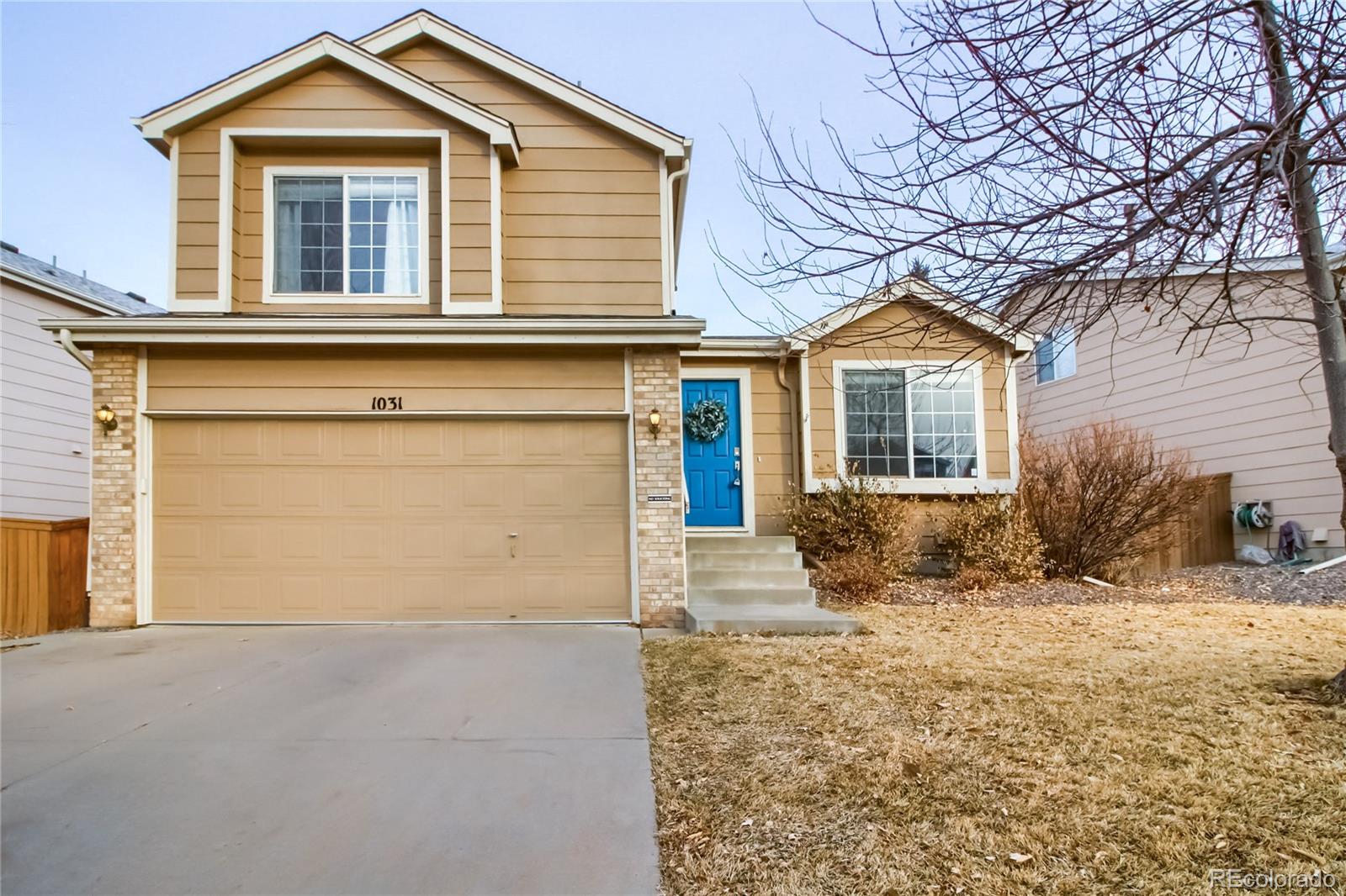 1031 Timbervale Trail Highlands Ranch, CO 80129 - Photo 1 of 34 front view of a house with a yard