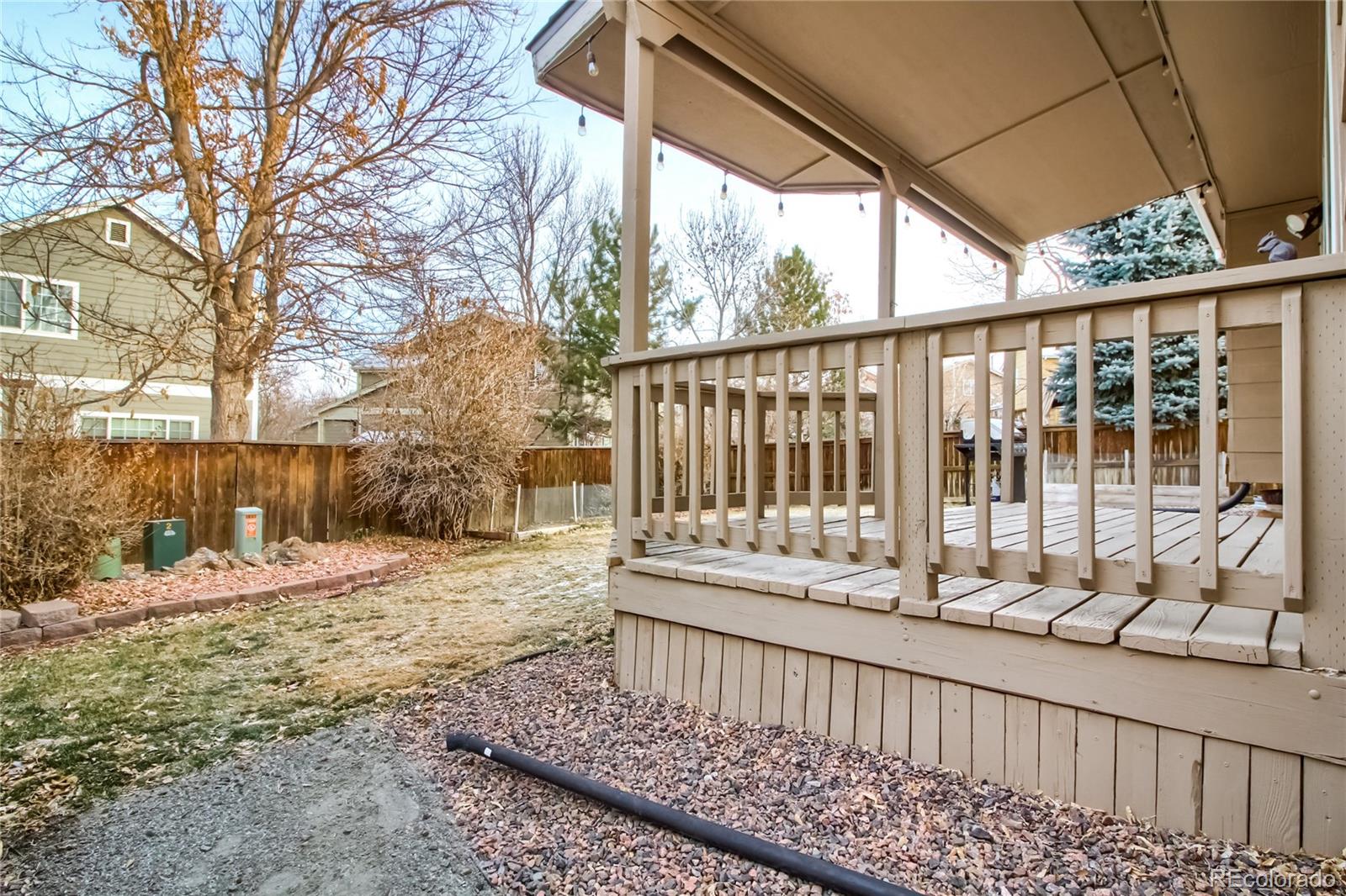 1031 Timbervale Trail Highlands Ranch, CO 80129 - Photo 28 of 34 a view of a porch with a yard