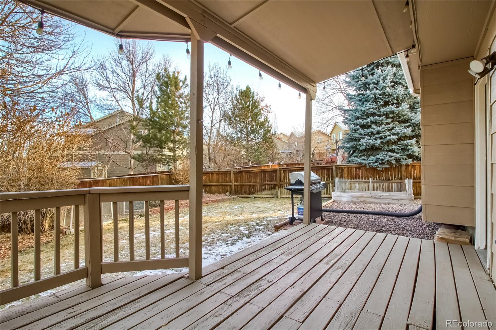 1031 Timbervale Trail Highlands Ranch, CO 80129 - Photo 33 of 34 a view of a balcony with wooden floor