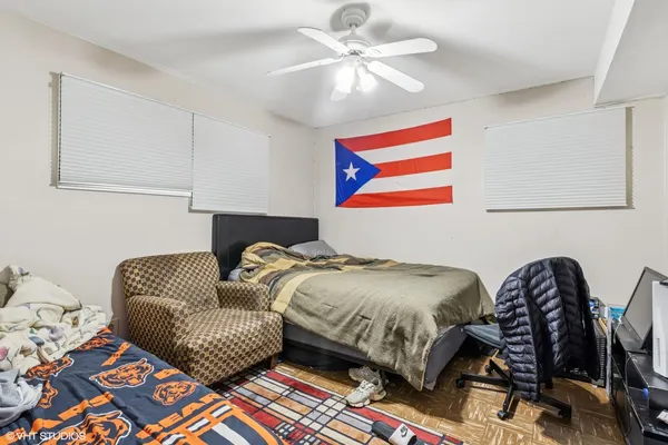 a bedroom with a bed and balcony