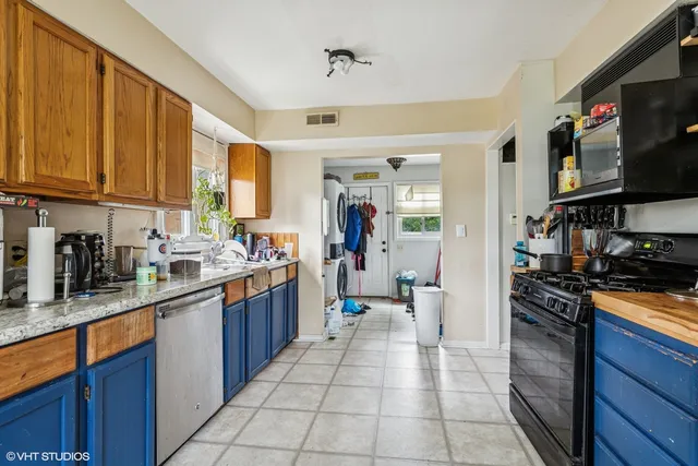 a living room with furniture and a bookshelf