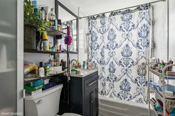 a bathroom with a sink toilet and a shower