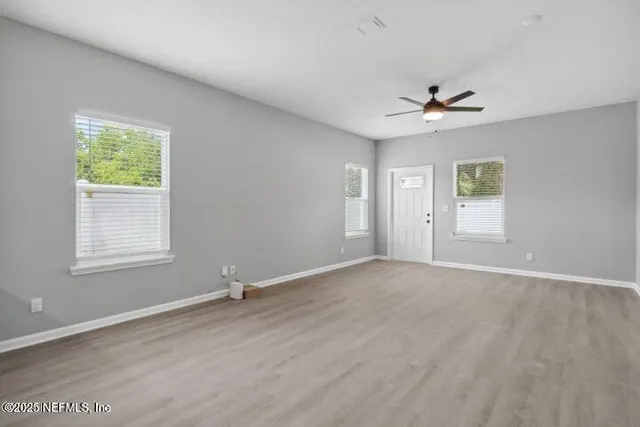 a view of an empty room with a window