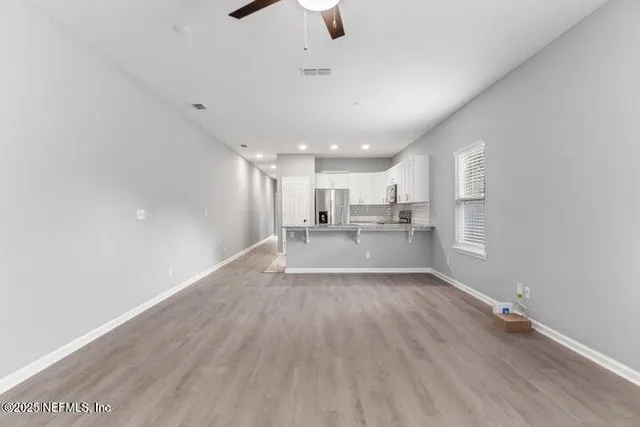 a view of kitchen with wooden floor