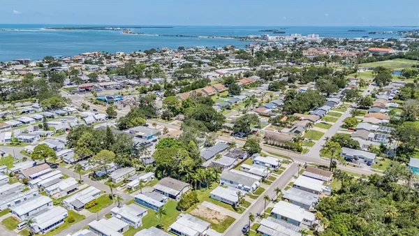 an aerial view of residential building with parking space