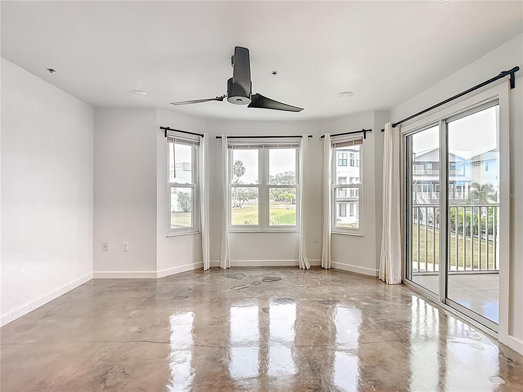 5722 Biscayne Court, Unit 103 New Port Richey, FL 34652 - Photo 11 of 99 a view of an empty room with a window