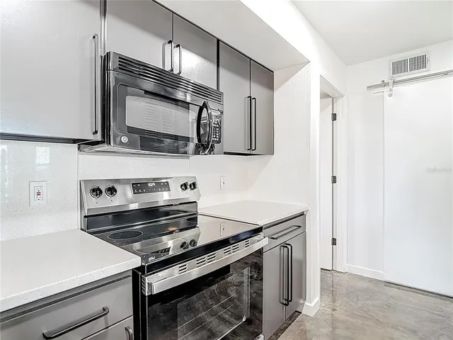 a close view of a utility room with dryer and washer