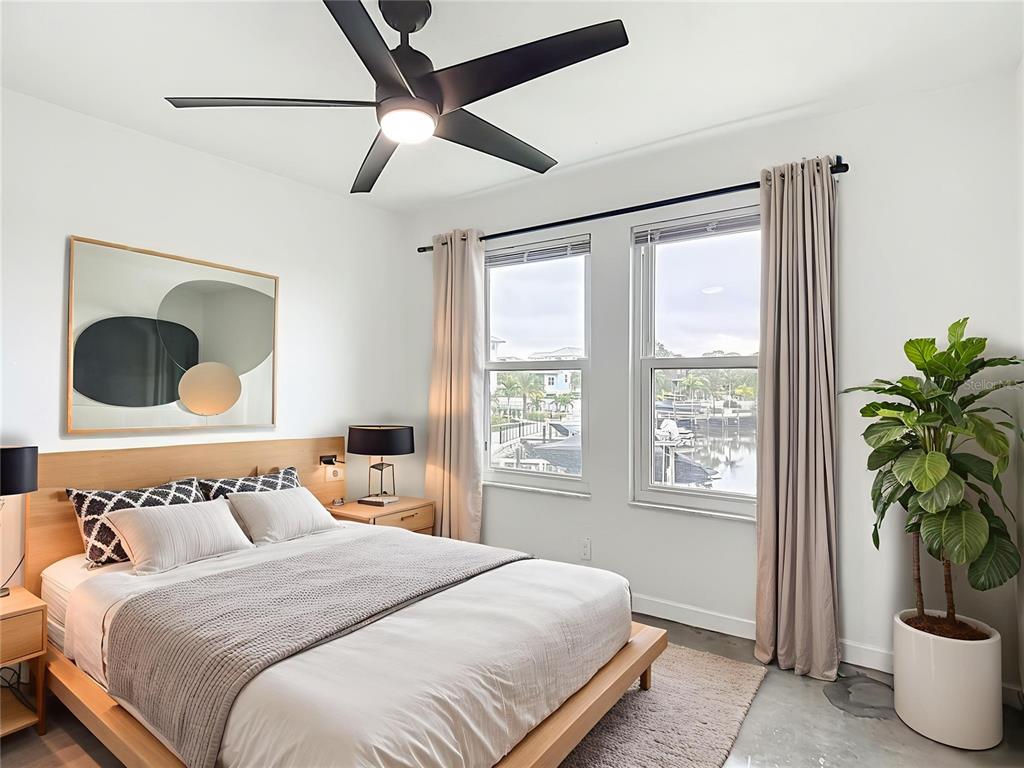 5722 Biscayne Court, Unit 103 New Port Richey, FL 34652 - Photo 22 of 99 a bedroom with bed and a window