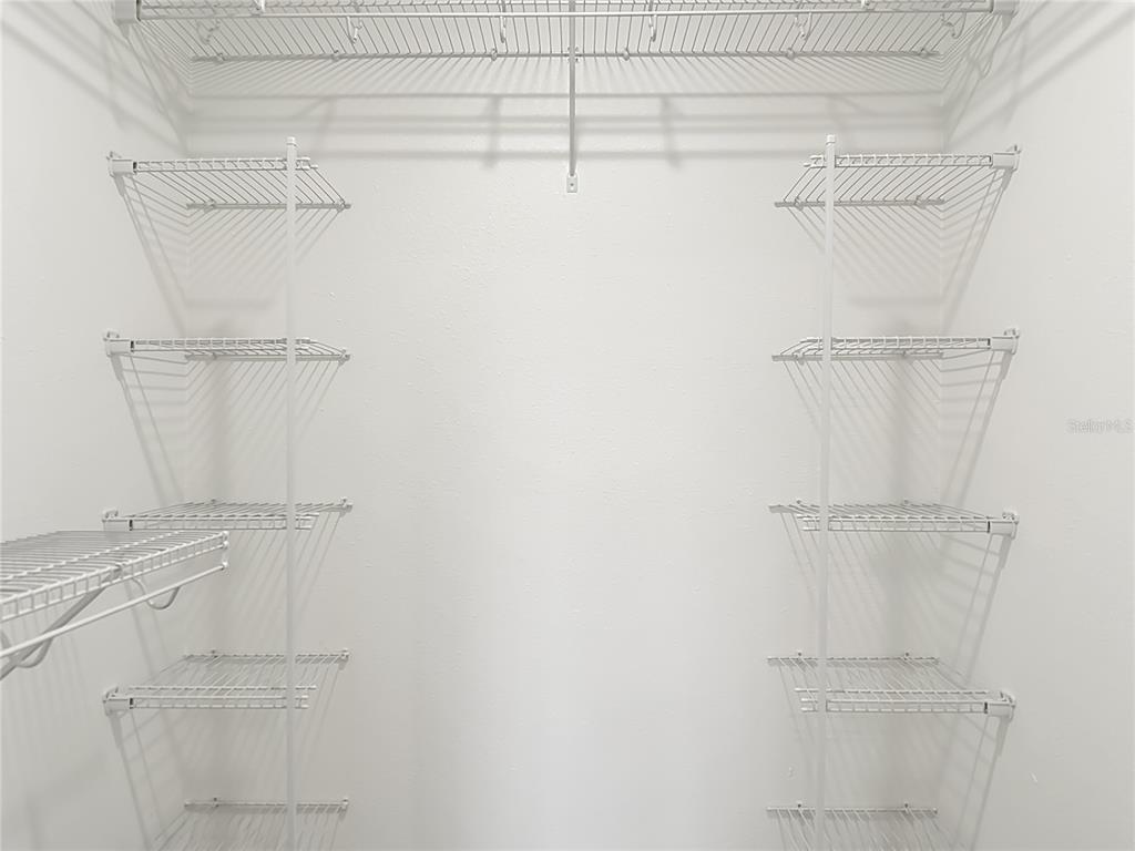 5722 Biscayne Court, Unit 103 New Port Richey, FL 34652 - Photo 24 of 99 a view of walk in closet