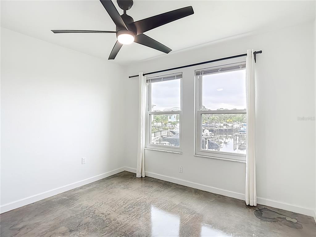 5722 Biscayne Court, Unit 103 New Port Richey, FL 34652 - Photo 31 of 99 a view of an empty room with a window