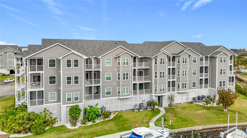 5722 Biscayne Court, Unit 103 New Port Richey, FL 34652 - Photo 45 of 99 front view of a house with a yard