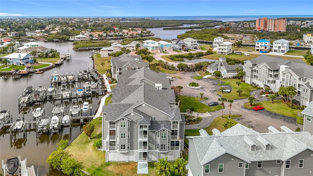 5722 Biscayne Court, Unit 103 New Port Richey, FL 34652 - Photo 49 of 99 an aerial view of residential building and lake