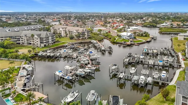 an aerial view of residential houses with outdoor space and river
