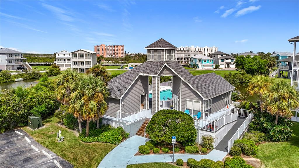 5722 Biscayne Court, Unit 103 New Port Richey, FL 34652 - Photo 51 of 99 a aerial view of a house with a yard and plants
