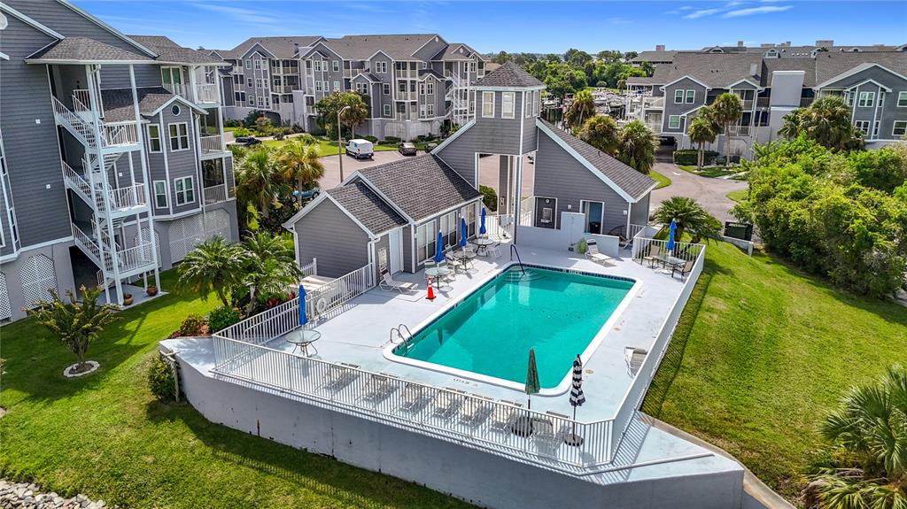 5722 Biscayne Court, Unit 103 New Port Richey, FL 34652 - Photo 53 of 99 a view of a house with a big yard plants and large trees