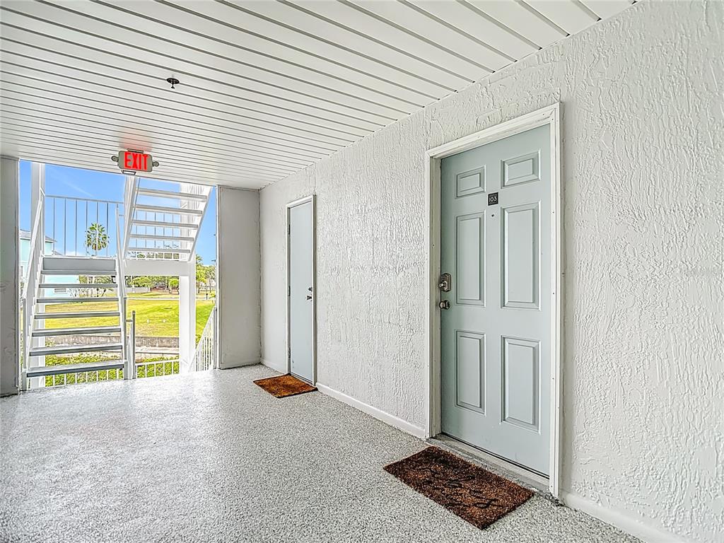 5722 Biscayne Court, Unit 103 New Port Richey, FL 34652 - Photo 6 of 99 a view of an empty room with a window