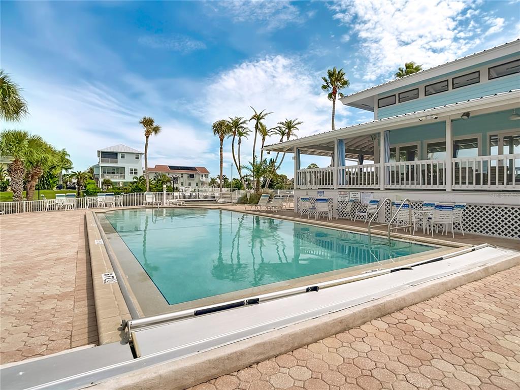 5722 Biscayne Court, Unit 103 New Port Richey, FL 34652 - Photo 73 of 99 a view of a swimming pool with a lake view