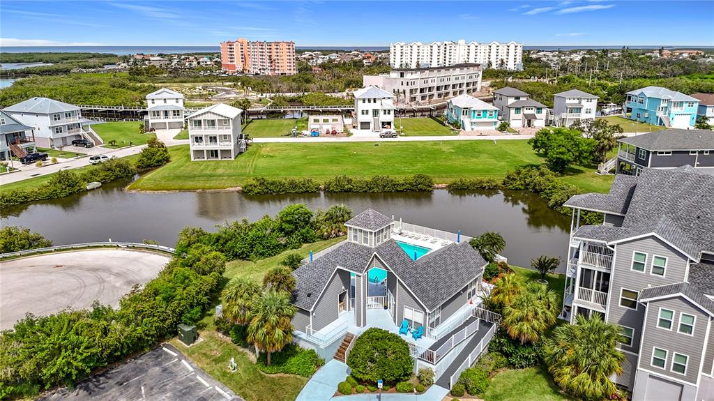 5722 Biscayne Court, Unit 103 New Port Richey, FL 34652 - Photo 93 of 99 an aerial view of residential houses with outdoor space and river