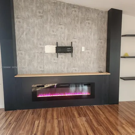 a bedroom with a bed and a fireplace