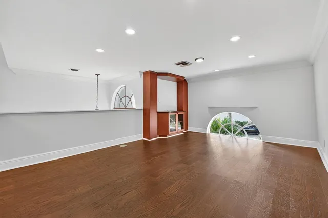 a large kitchen with cabinets and stainless steel appliances