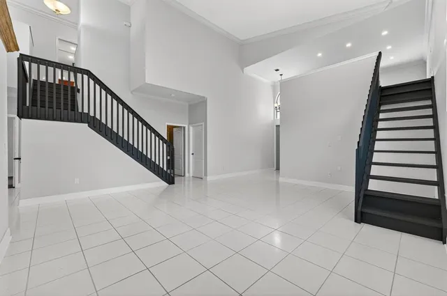 a kitchen with kitchen island granite countertop a sink a counter top space appliances and cabinets