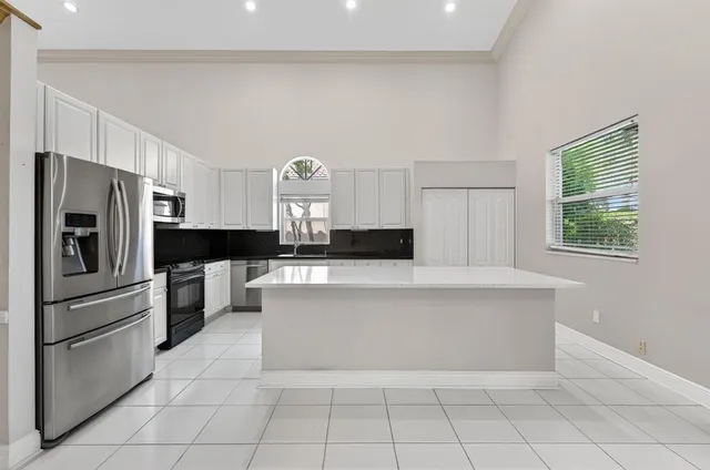 a view of an empty room and wooden floor