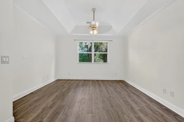 a bathroom with a bathtub a sink and a window
