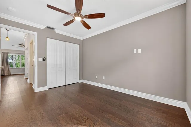an aerial view of residential house with outdoor space and trees all around