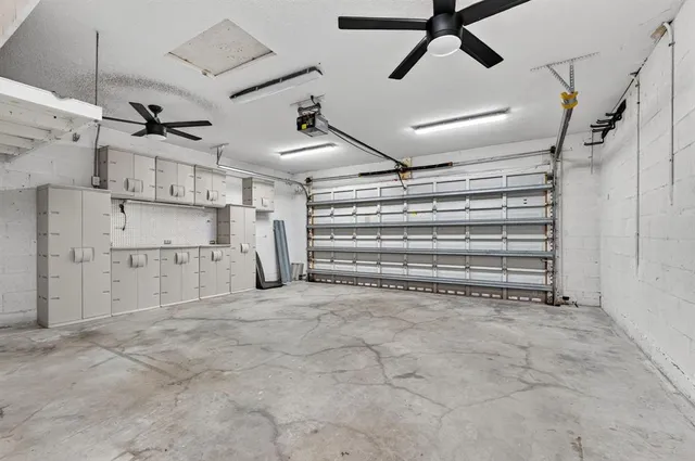 an aerial view of a house with yard