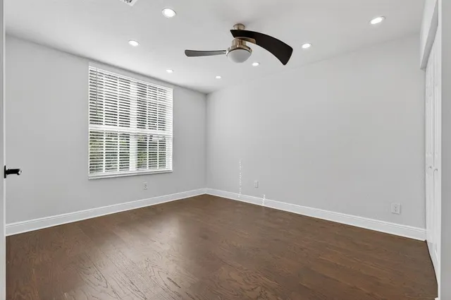a view of a hallway with entryway and stairs