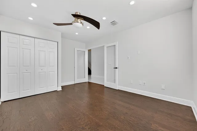 a view of kitchen with cabinets and refrigerator