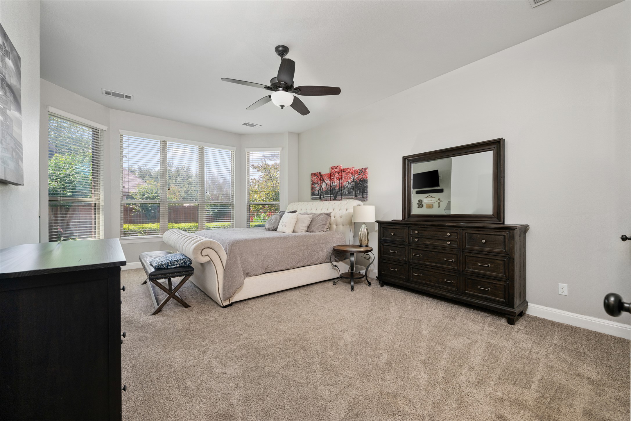 3021 Wedgescale Pass Leander, TX 78641 - Photo 12 of 40 a bedroom with a bed and wooden floor