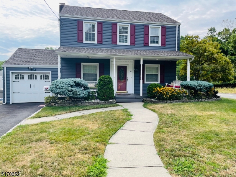 57 Russell Avenue Rahway, NJ 07065 - Photo 1 of 20 a front view of a house with a yard