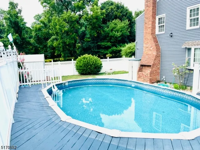 a view of swimming pool with a patio
